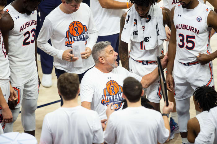 Auburn Tigers head coach Bruce Pearl talks with his team during a timeout as Auburn Tigers men's basketball takes on Texas A&M Aggies at Auburn Arena in Auburn, Ala., on Saturday, Feb. 12, 2022. Auburn Tigers defeated Texas A&M Aggies 75-58.